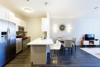 Interior kitchen with island and dining area-